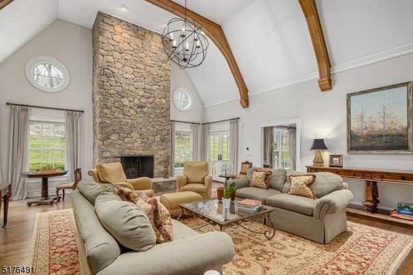 Chandelier, Fireplace, Interior, Living room, Stone Walls, Wooden Beams, Wood Texture Flooring