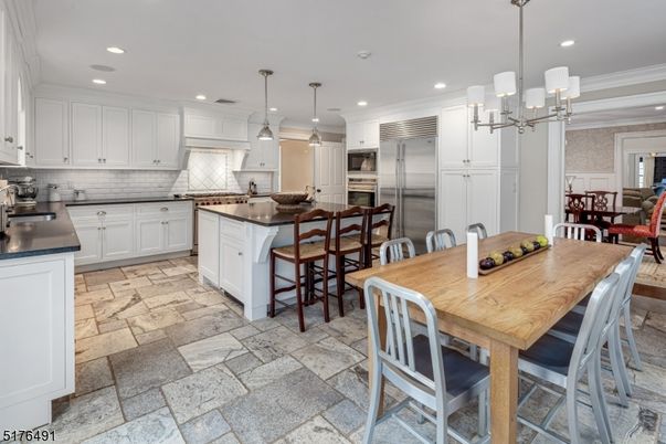 Chandelier, Dining room, Interior, Kitchen, Pendant Lights, Recessed Lighting, Stainless Steel Appliances