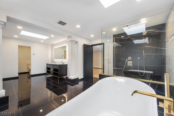 Bathroom, Dual Sink Vanities, Free Standing Baths, Glass Shower, Interior, Marble Walls, Recessed Lighting