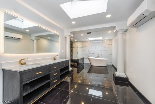 Bathroom, Dual Sink Vanities, Free Standing Baths, Glass Shower, Interior, Marble, Marble Walls, Recessed Lighting