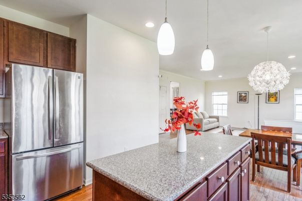 Dining room, Interior, Kitchen, Living room, Pendant Lights, Recessed Lighting, Stainless Steel Appliances, Wood Texture Flooring