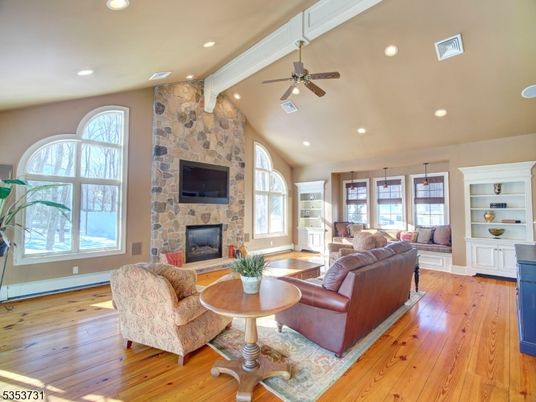 Fireplace, Interior, Living room, Recessed Lighting, Stone Walls, Wood Texture Flooring