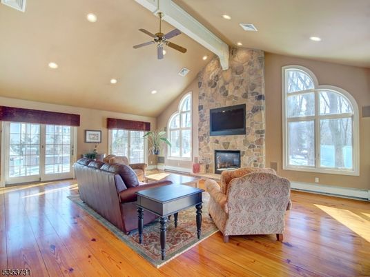 Fireplace, Interior, Living room, Recessed Lighting, Stone Walls, Wood Texture Flooring