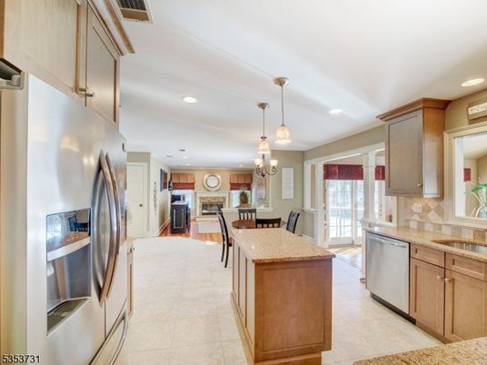 Chandelier, Dining room, Fireplace, Interior, Kitchen, Living room, Pendant Lights, Recessed Lighting, Stainless Steel Appliances