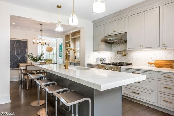 Chandelier, Dining room, Interior, Kitchen, Pendant Lights, Recessed Lighting, Stainless Steel Appliances, Wood Texture Flooring