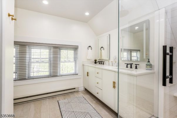 Bathroom, Dual Sink Vanities, Glass Shower, Interior, Recessed Lighting, Wood Texture Flooring