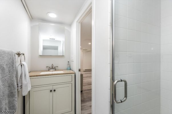 Bathroom, Glass Shower, Interior, Recessed Lighting, Wood Texture Flooring