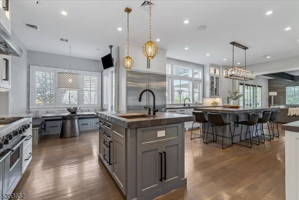 Chandelier, Dining room, Interior, Kitchen, Pendant Lights, Recessed Lighting, Stainless Steel Appliances, Wood Texture Flooring