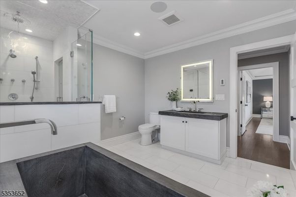 Bathroom, Dual Sink Vanities, Glass Shower, Interior, Recessed Lighting, Wood Texture Flooring