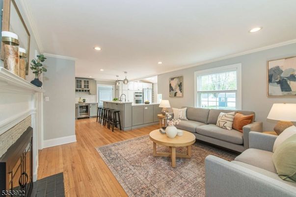 Fireplace, Interior, Kitchen, Living room, Pendant Lights, Recessed Lighting, Stainless Steel Appliances, Wood Texture Flooring
