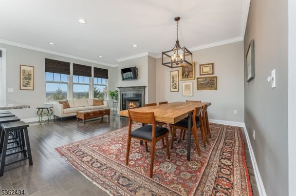 Dining room, Fireplace, Interior, Living room, Pendant Lights, Recessed Lighting, Wood Texture Flooring