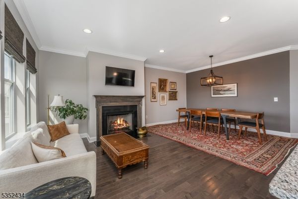 Dining room, Fireplace, Interior, Living room, Pendant Lights, Recessed Lighting, Wood Texture Flooring