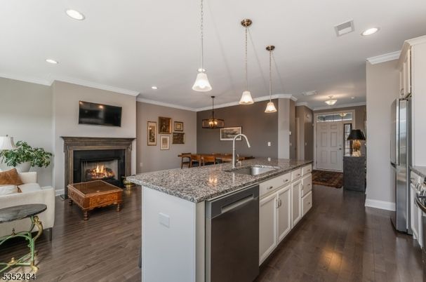 Fireplace, Interior, Kitchen, Living room, Pendant Lights, Recessed Lighting, Stainless Steel Appliances, Wood Texture Flooring