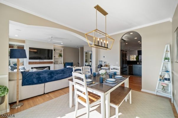 Dining room, Fireplace, Interior, Living room, Pendant Lights, Recessed Lighting, Wood Texture Flooring