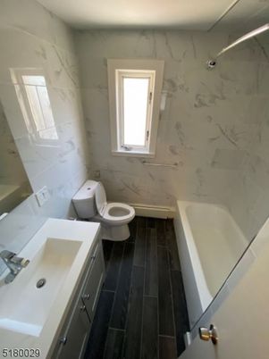 Bathroom, Dual Sink Vanities, Interior, Marble Walls, Wood Texture Flooring