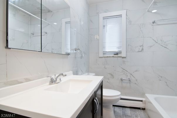 Bathroom, Glass Shower, Interior, Marble Walls, Wood Texture Flooring
