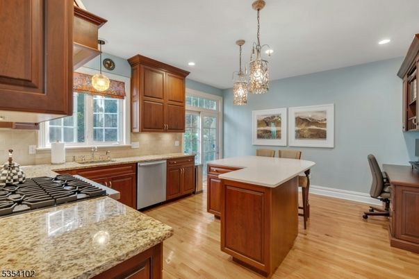 Chandelier, Dining room, Interior, Kitchen, Pendant Lights, Recessed Lighting, Stainless Steel Appliances, Wood Texture Flooring