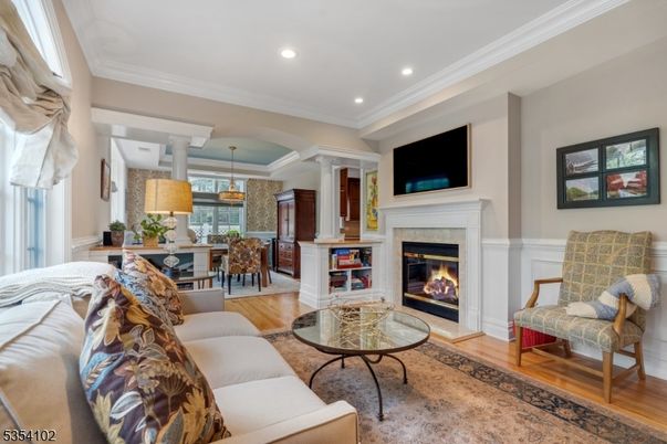 Dining room, Fireplace, Interior, Living room, Pendant Lights, Recessed Lighting, Wood Texture Flooring