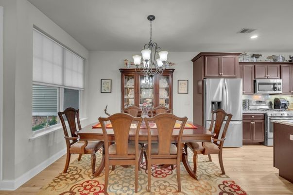 Chandelier, Dining room, Interior, Kitchen, Recessed Lighting, Stainless Steel Appliances, Wood Texture Flooring
