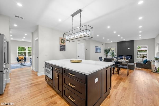 Dining room, Fireplace, Interior, Kitchen, Living room, Pendant Lights, Recessed Lighting, Wood Texture Flooring