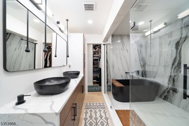 Bathroom, Dual Sink Vanities, Free Standing Baths, Glass Shower, Interior, Marble Walls, Recessed Lighting, Walk-in Closets, Wood Texture Flooring