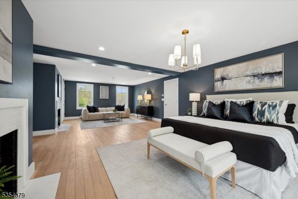 Bedroom, Fireplace, Interior, Living room, Pendant Lights, Recessed Lighting, Wood Texture Flooring