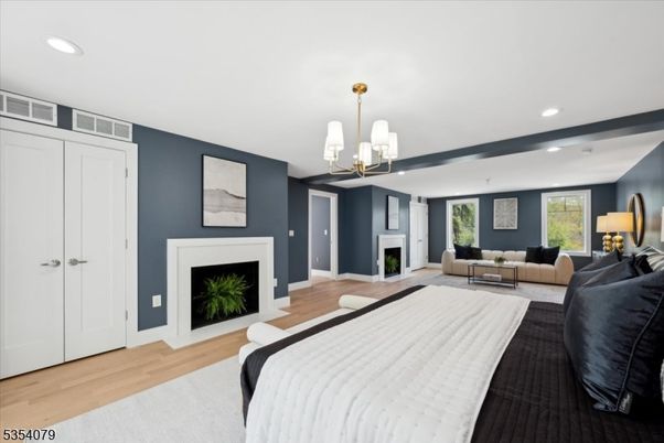 Bedroom, Fireplace, Interior, Pendant Lights, Recessed Lighting, Wood Texture Flooring