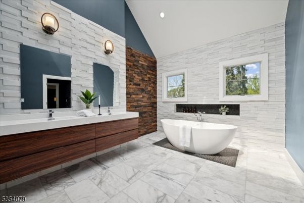 Bathroom, Dual Sink Vanities, Free Standing Baths, Interior, Marble, Recessed Lighting, Stone Walls, Wooden Walls