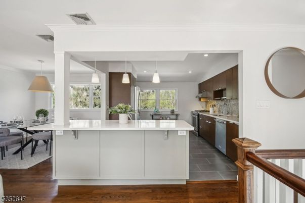 Dining room, Interior, Kitchen, Pendant Lights, Recessed Lighting, Stainless Steel Appliances, Wood Texture Flooring