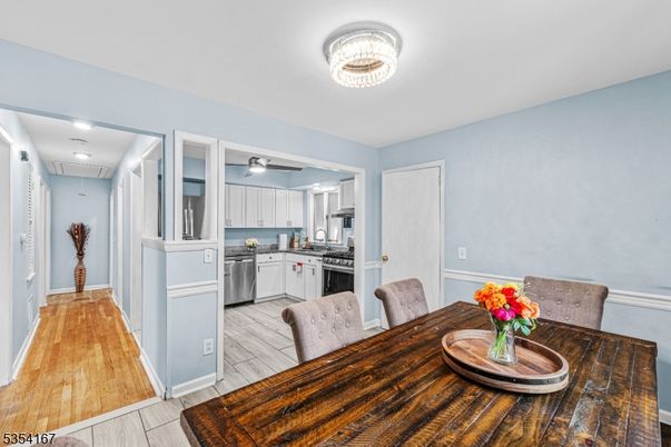 Dining room, Interior, Kitchen, Recessed Lighting, Stainless Steel Appliances, Wood Texture Flooring