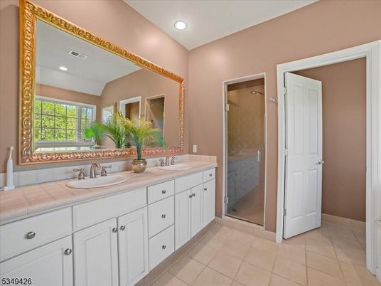 Bathroom, Dual Sink Vanities, Glass Shower, Interior, Recessed Lighting, Tile Countertops