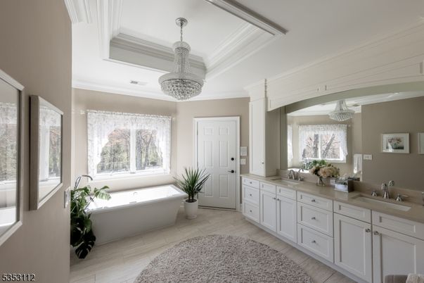 Bathroom, Chandelier, Dual Sink Vanities, Free Standing Baths, Interior, Pendant Lights, Wood Texture Flooring