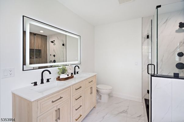 Bathroom, Dual Sink Vanities, Glass Shower, Interior, Marble, Marble Walls, Recessed Lighting
