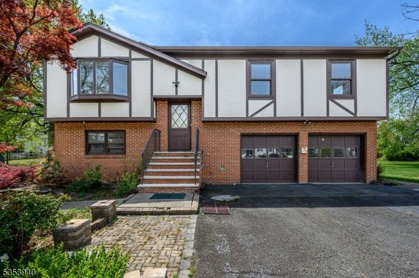 Attached, Exterior, Facade, Brick Facade, Tudor Revival