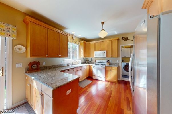 Interior, Kitchen, Recessed Lighting, Washer, Wood Texture Flooring