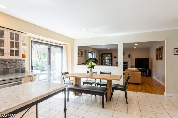 Dining room, Fireplace, Interior, Living room, Recessed Lighting, Wood Texture Flooring