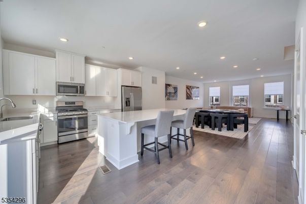 Dining room, Interior, Kitchen, Recessed Lighting, Stainless Steel Appliances, Wood Texture Flooring