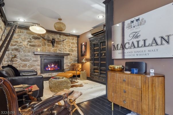 Fireplace, Interior, Living room, Recessed Lighting, Stone Walls, Wood Texture Flooring