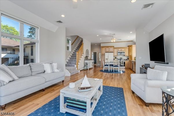 Dining room, Interior, Kitchen, Living room, Recessed Lighting, Stainless Steel Appliances, Wood Texture Flooring