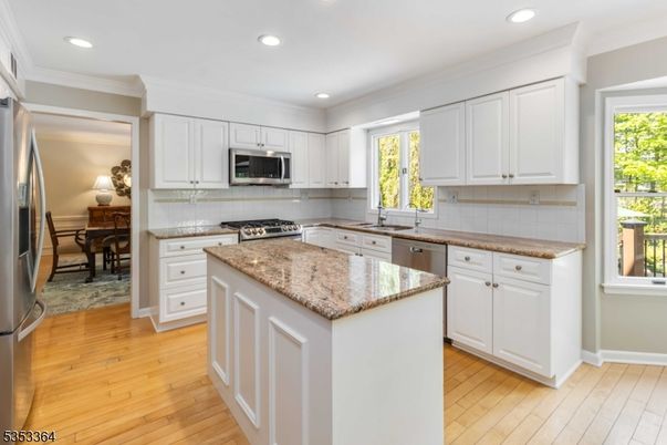 Dining room, Interior, Kitchen, Recessed Lighting, Stainless Steel Appliances, Wood Texture Flooring