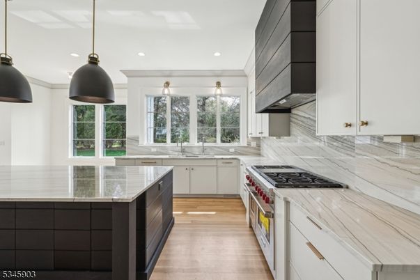 Interior, Kitchen, Marble Walls, Pendant Lights, Recessed Lighting, Stainless Steel Appliances, Wood Texture Flooring
