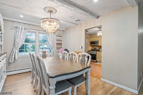 Chandelier, Dining room, Interior, Kitchen, Recessed Lighting, Stainless Steel Appliances, Wood Texture Flooring