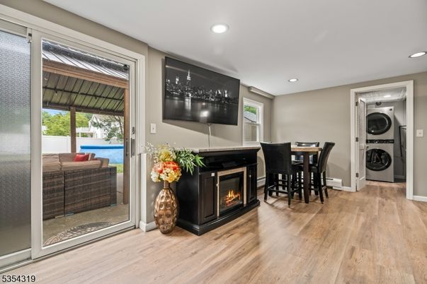 Dining room, Fireplace, Interior, Recessed Lighting, Washer, Wood Texture Flooring
