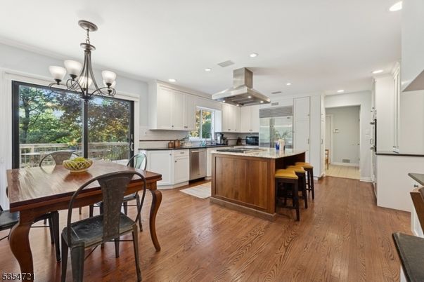 Chandelier, Dining room, Interior, Kitchen, Recessed Lighting, Stainless Steel Appliances, Wood Texture Flooring