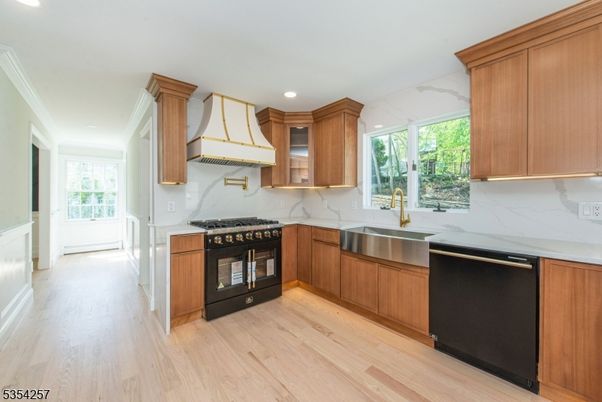 Interior, Kitchen, Marble Walls, Recessed Lighting, Stainless Steel Appliances, Wood Texture Flooring