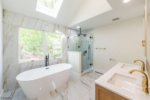 Bathroom, Dual Sink Vanities, Free Standing Baths, Glass Shower, Interior, Marble, Marble Walls, Recessed Lighting
