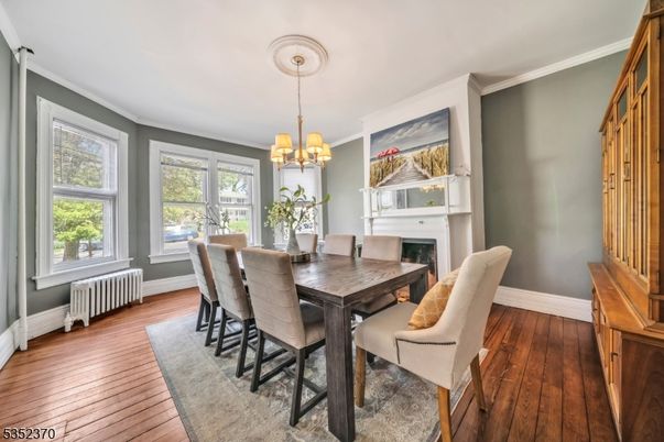 Chandelier, Dining room, Fireplace, Interior, Wood Texture Flooring