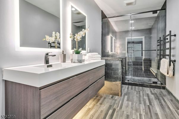 Bathroom, Dual Sink Vanities, Glass Shower, Interior, Recessed Lighting, Wood Texture Flooring