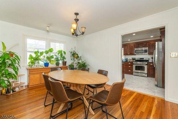 Dining room, Interior, Kitchen, Recessed Lighting, Stainless Steel Appliances, Wood Texture Flooring