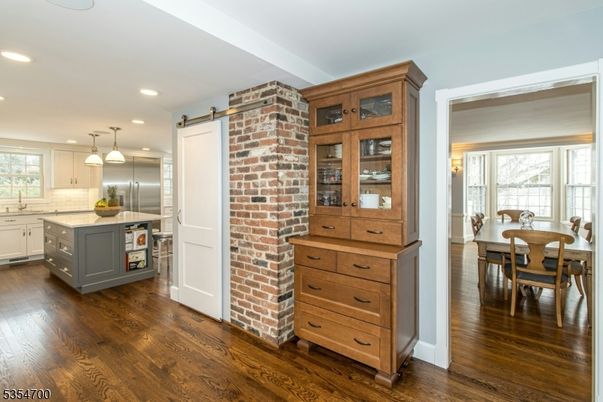 Dining room, Interior, Kitchen, Pendant Lights, Recessed Lighting, Stainless Steel Appliances, Stone Walls, Wood Texture Flooring
